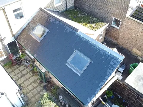 Two new Velux roof windows fitted into a new slate roof on a rear extension
